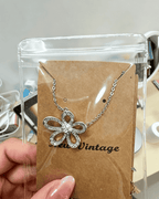 Vintage Hollow‑Flower Shiny Rhinestone Pendant Necklace