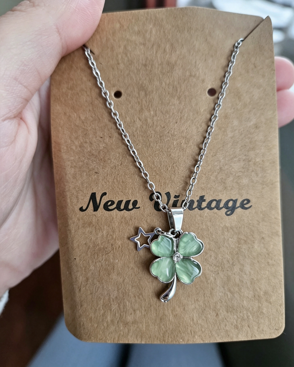 Packaged in green wrapping Four‑Leaf Clover Necklace