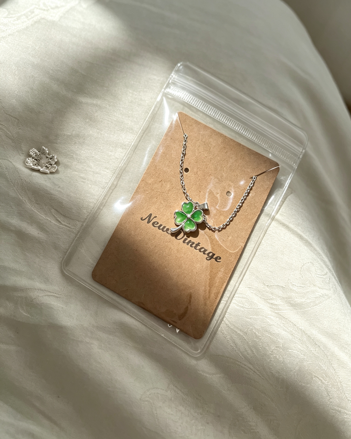 Packaged in green wrapping Four‑Leaf Clover Necklace
