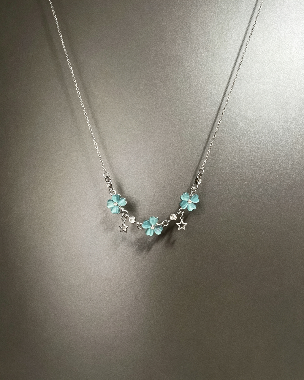 Vintage Lucky Four‑Leaf Silver-plated necklace featuring three four-leaf clovers and stars