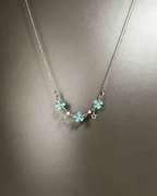 Vintage Lucky Four‑Leaf Silver-plated necklace featuring three four-leaf clovers and stars