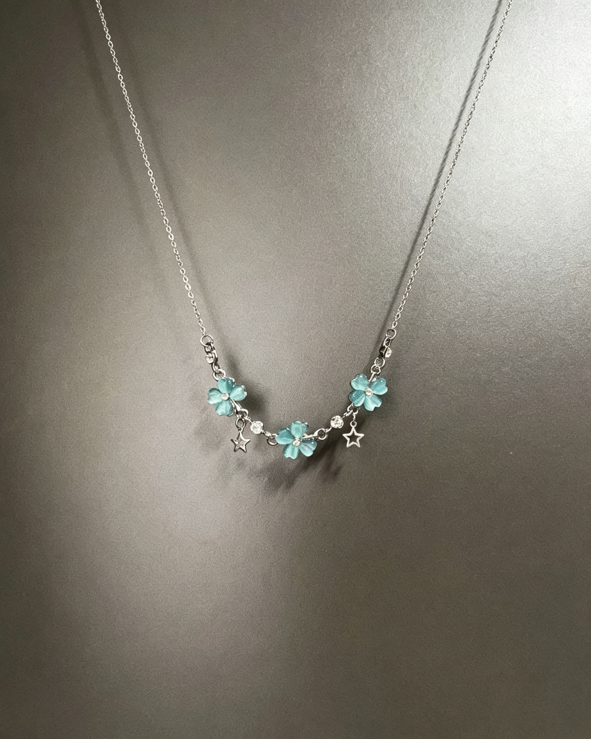 Vintage Lucky Four‑Leaf Silver-plated necklace featuring three four-leaf clovers and stars