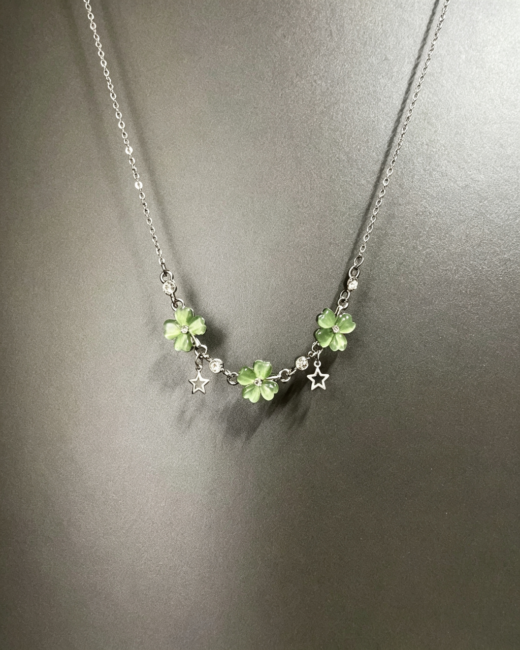 Vintage Lucky Four‑Leaf Silver-plated necklace featuring three four-leaf clovers and stars