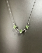 Vintage Lucky Four‑Leaf Silver-plated necklace featuring three four-leaf clovers and stars