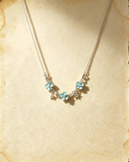 Blue Vintage Lucky Four‑Leaf Silver-plated necklace featuring three four-leaf clovers and stars