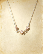 Pink Vintage Lucky Four‑Leaf Silver-plated necklace featuring three four-leaf clovers and stars