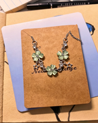 Vintage Lucky Four‑Leaf Silver-plated necklace featuring three four-leaf clovers and stars