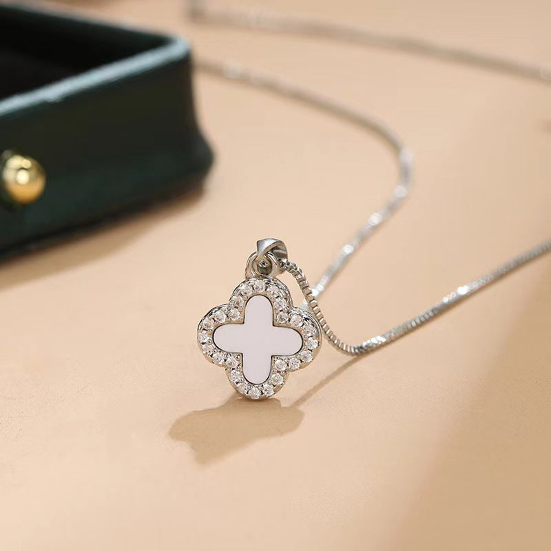 Black and white four-leaf clover necklace